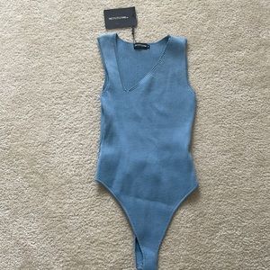 Blue bodysuit. New with tags.